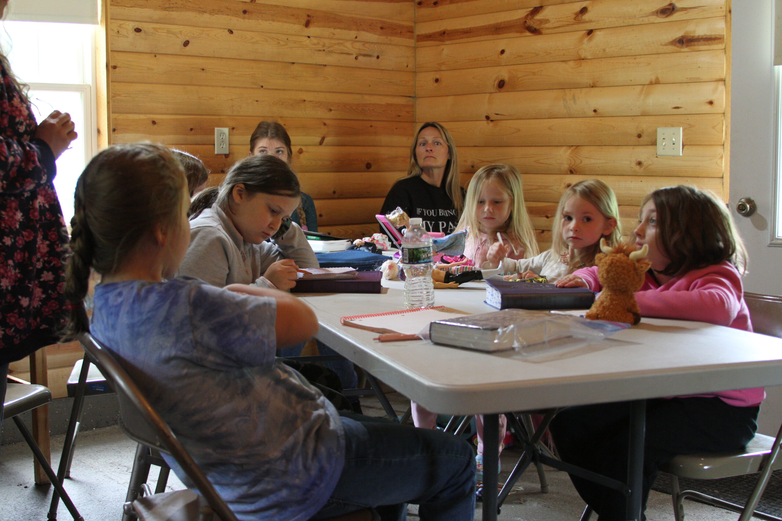 Campers gathered around a campfire for worship